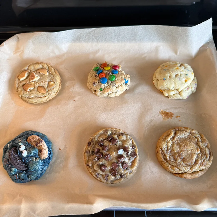Sheet pan of assorted mini cookies fresh from the oven